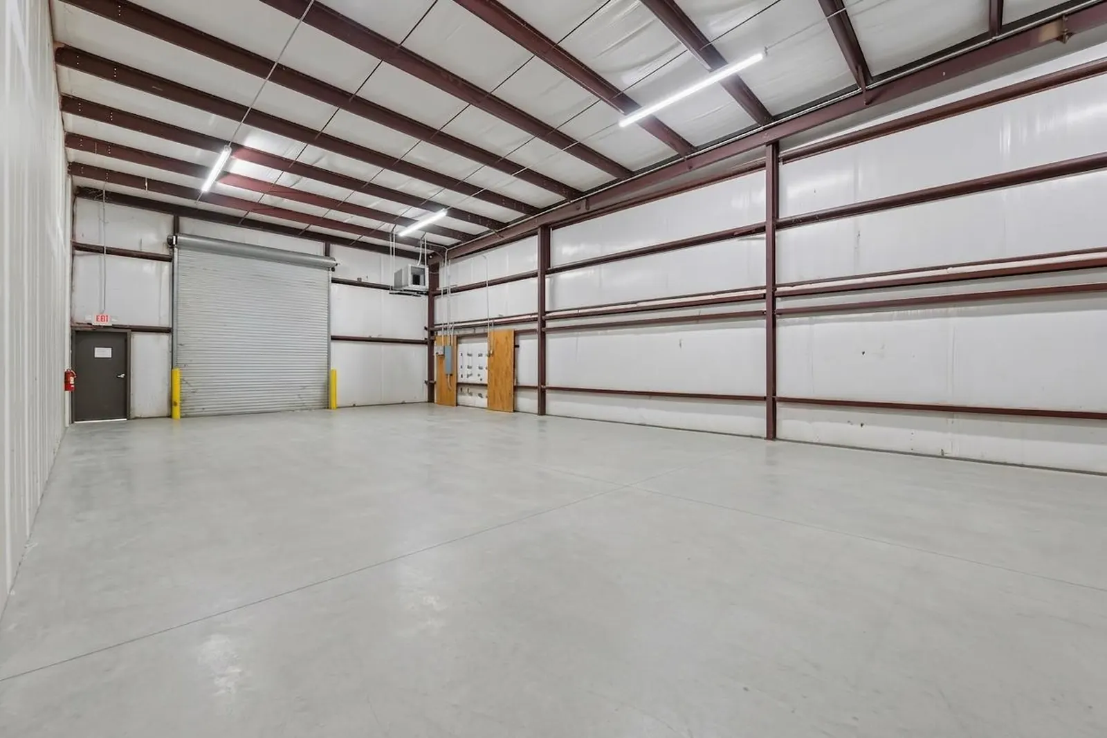 After: the same warehouse bay with the concrete floor shown clean and even.